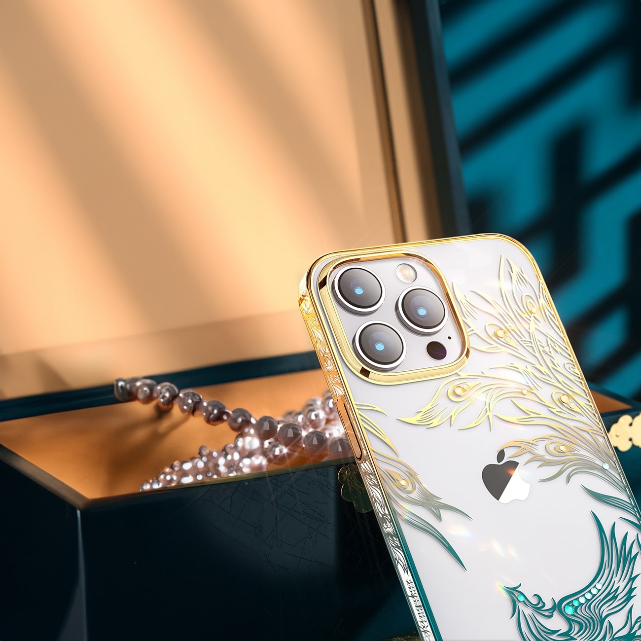 Luksus iPhone 14 Plus-etui med Kingxbar Phoenix-krystaller - guld og blå